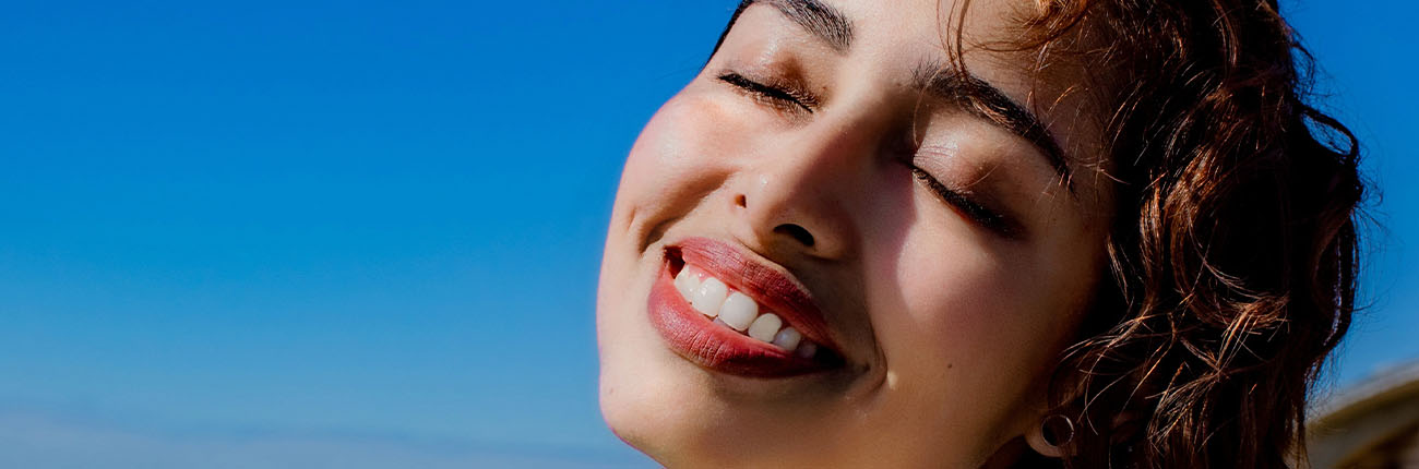 This is a header image of What does being happy do to your skin? on www.sublimelife.in